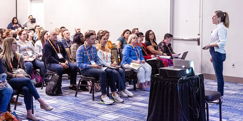 Learning leaders attending engaging sessions